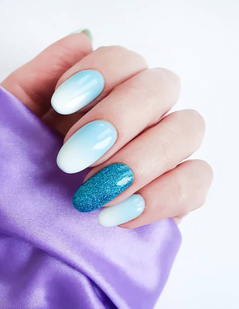 istock female hand manicure silk fabric 1146325126