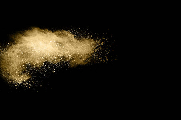 istock Golden powder explosion on black background. Freeze motion. 1146331686