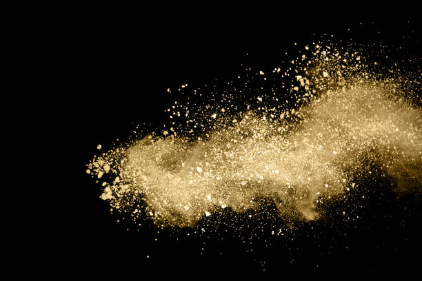 istock Golden powder explosion on black background. Freeze motion. 1146331696