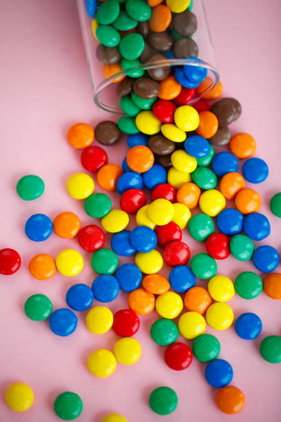 istock Glass Glass Filled Candy. Rose Background. Colored Candy. Diet. 1146335172