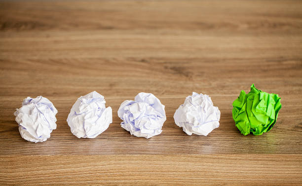istock Great idea concept. Crumpled colorful paper on wooden table. Copy space 1146343988