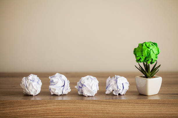 istock Great idea concept. Crumpled colorful paper on wooden table 1146344045