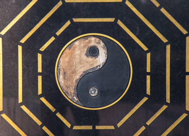 Yin Yang symbol. carved on black marble, yin yang, golden edge, Chinese symbol