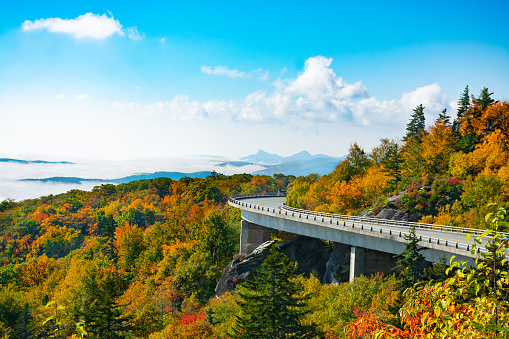Beautiful mountain autumn  landscape with clouds over the beautiful mountains. Linn Cove Viaduct. Close to Blowing Rock, Blue Ridge Parkway, North Carolina, USA.