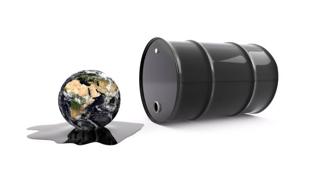 istock Oil drum spilling oil onto planet Earth 1146348867