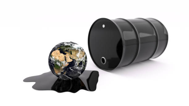 istock Oil drum spilling oil onto planet Earth 1146348868