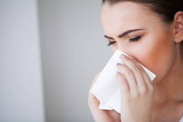 istock Flu and Sick Woman. Sick Woman Using Paper Tissue, Head Cold Problem 1146348926