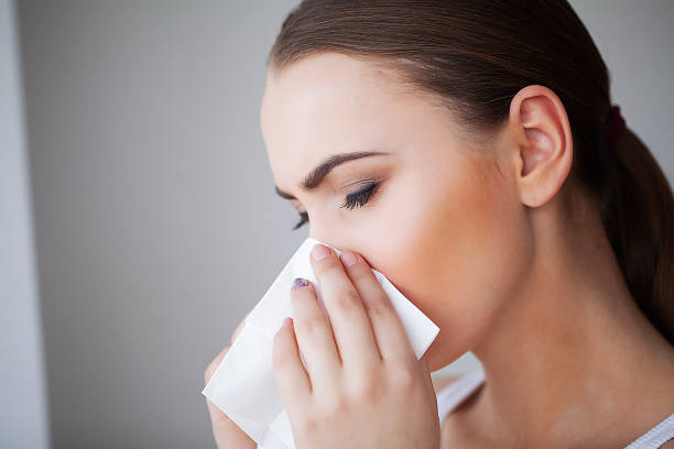 istock Flu and Sick Woman. Sick Woman Using Paper Tissue, Head Cold Problem 1146348960