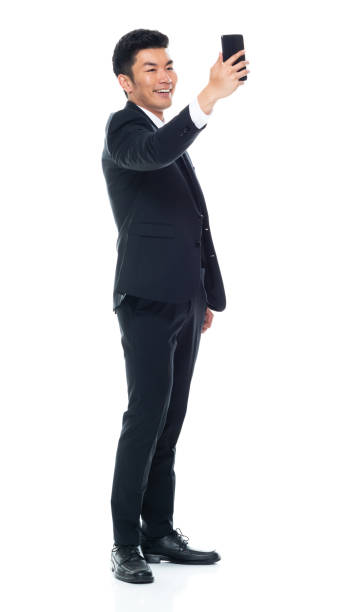 istock Attractive looking Chinese businessman - taking a selfie 1146349889