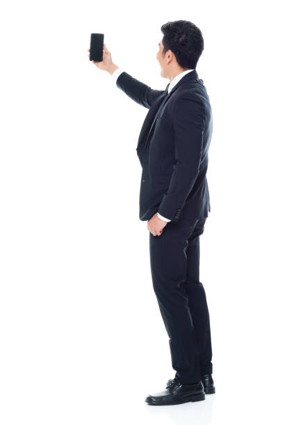 istock Attractive looking Chinese businessman - taking a selfie 1146349909