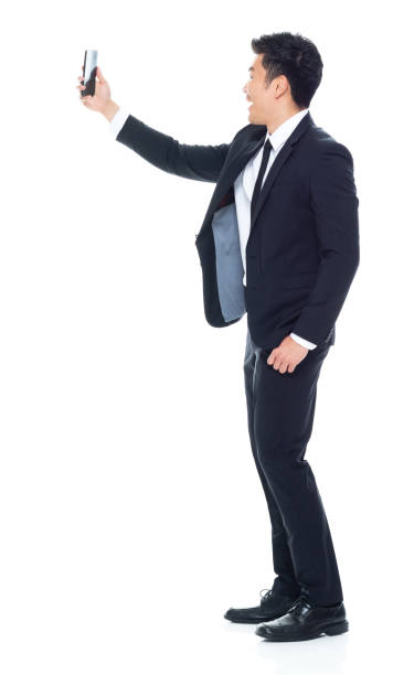 istock Attractive looking Chinese businessman - taking a selfie 1146349914