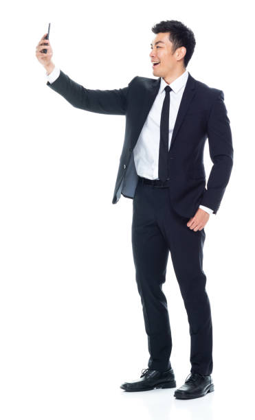 istock Attractive looking Chinese businessman - taking a selfie 1146349916