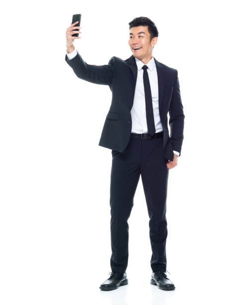 Attractive looking Chinese businessman - taking a selfie