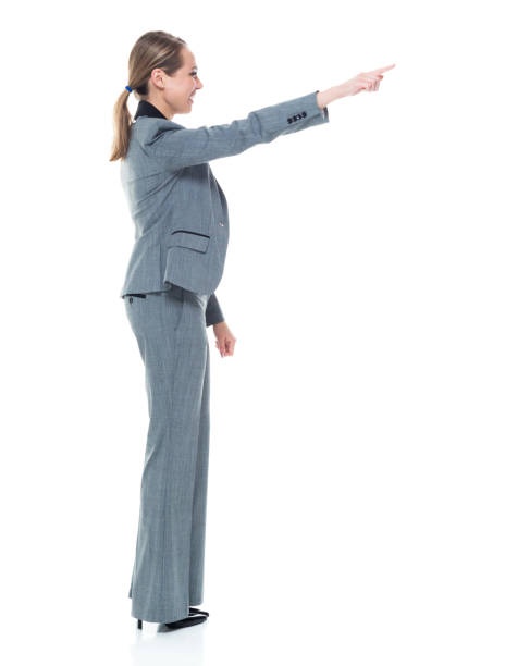 istock Businesswoman in grey suit on white background - pointing 1146351883