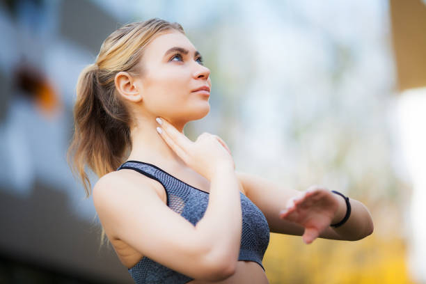 istock Female runner stretching before running in city park 1146352639