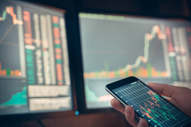 istock Young male trader at office work concept sitting with smartphone close-up 1146353909