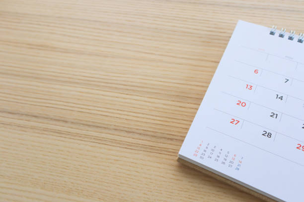 istock calendar page on wood table background 1146353958