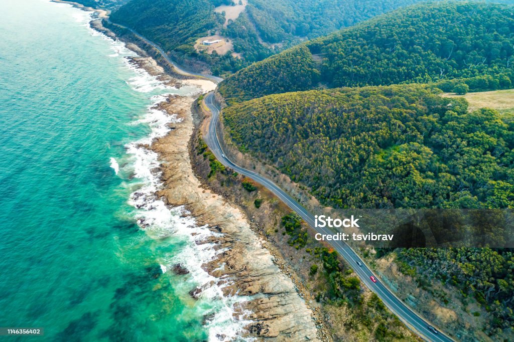 Cars driving on Great Ocean Road, Victoria, Australia  - aerial view Australia Stock Photo