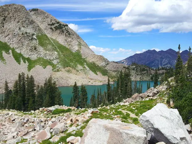 First view of White Pine lake in Little Cottonwood Canyon near Alta, Utah from the 10200 foot high pass on the trail.