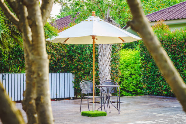istock Modern metal table, chairs and parasol on decks 1146362848
