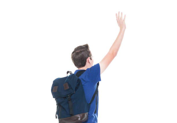 istock Young high school age male student is waving 1146365770
