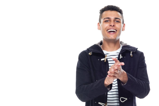 istock Handsome black man with curly hair and wearing a jacket - clapping 1146366705