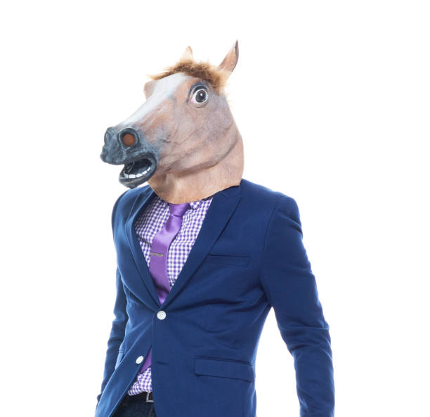 istock Businessman with horse mask is dancing 1146366706