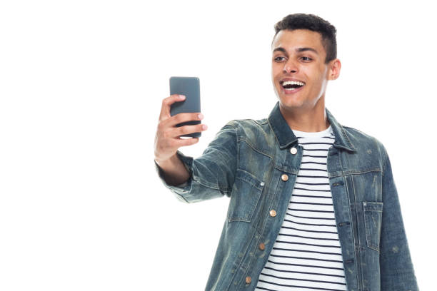istock Good looking tall black man wearing denim jacket - taking a selfie 1146366895
