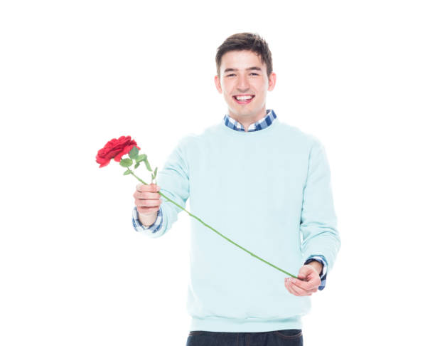 istock Attractive man is holding a red rose 1146367005