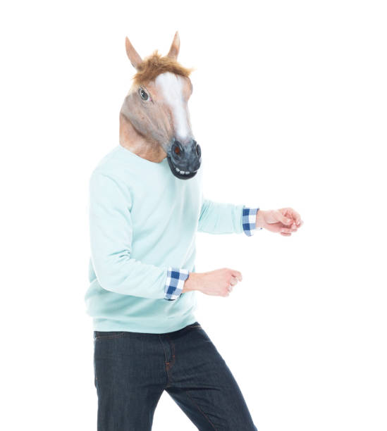 istock Man with horse mask and dancing 1146367871