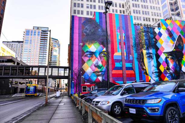 Minneapolis, Minnesota USA. 01/05/2019: Streets of Downtown Minneapolis in winter months. A street with public train transport, parking lot and bright mural visible to the public.