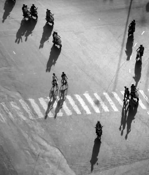 istock Amazing scene from high view, shadow people ride motorbikes on road surface 1146393092