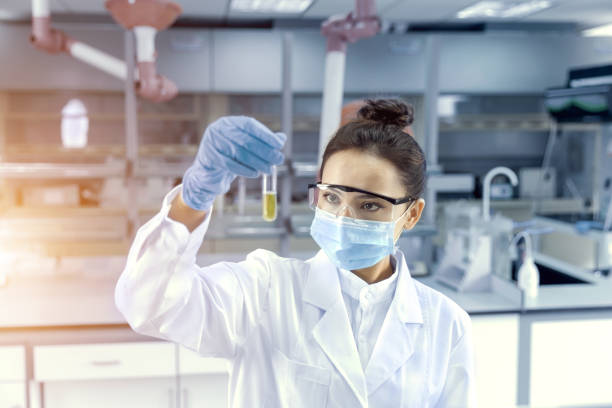 Female scientist analyzing sample in the laboratory stock photo