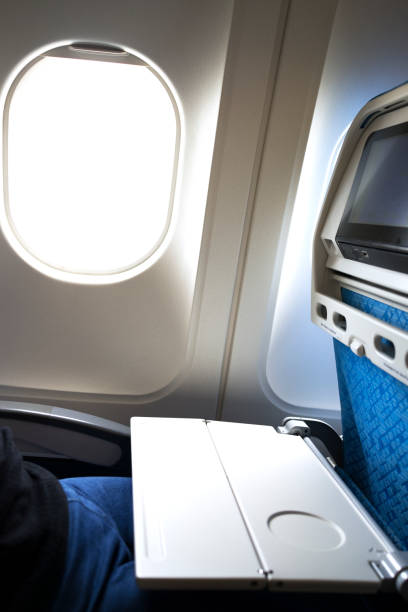 istock Airplane tray table opened on seat back by the window 1146395532