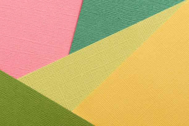 Red, green, yellow abstract paper background. Paper texture close up