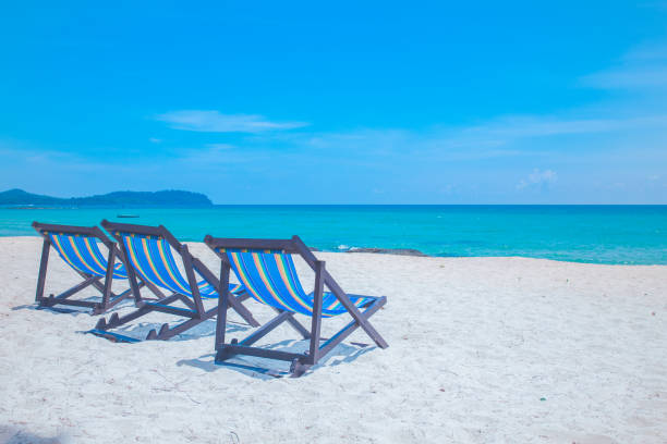 istock Beach chairs with sea and bright sky 1146399481