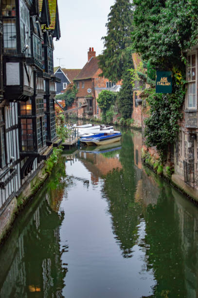 istock Canterbury canal with a house which has a chair for witch punishment. 1146404650