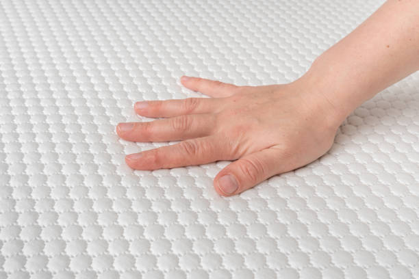 istock Woman is choosing new mattress for good sleeping 1146406774