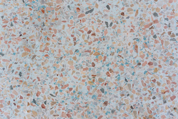 istock Orange and Teal Terrazzo style stone floor texture with light coloured background 1146412854