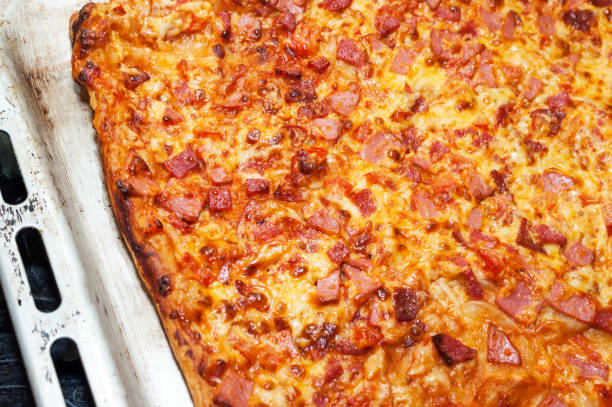istock Freshly Baked and Hot Pizza on a Sheet Pan. 1146416733
