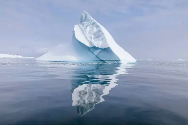 Iceberg reflected in the ocean of Errera Channel, Antarctic Peninsula