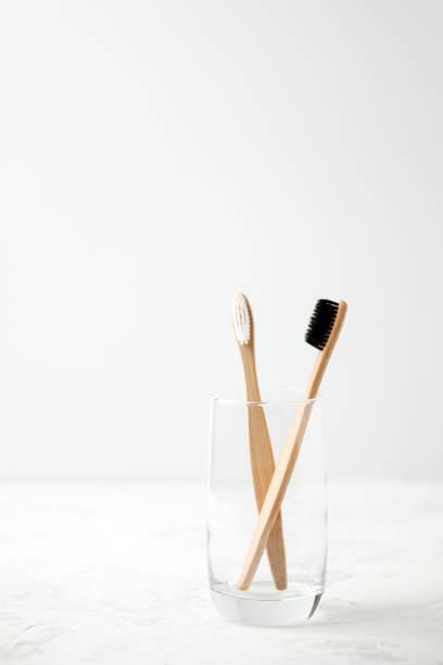 istock Bamboo teeth brush on minimalistic backgroud. zero waste concept, white background, eco friendly modern simple idea, copy space 1146416901