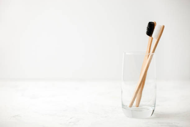 istock Bamboo teeth brush on minimalistic backgroud. zero waste concept, white background, eco friendly modern simple idea, copy space 1146416905