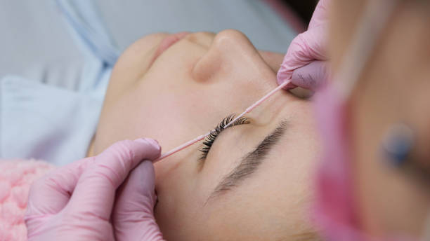 istock Eyelash Extension Procedure. Woman Eye with Long Eyelashes 1146421786