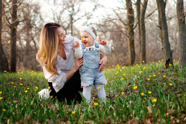 istock Happy family walks in the spring meadow 1146421788