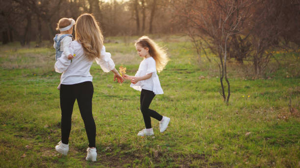 istock Happy family walks in the spring meadow 1146421800