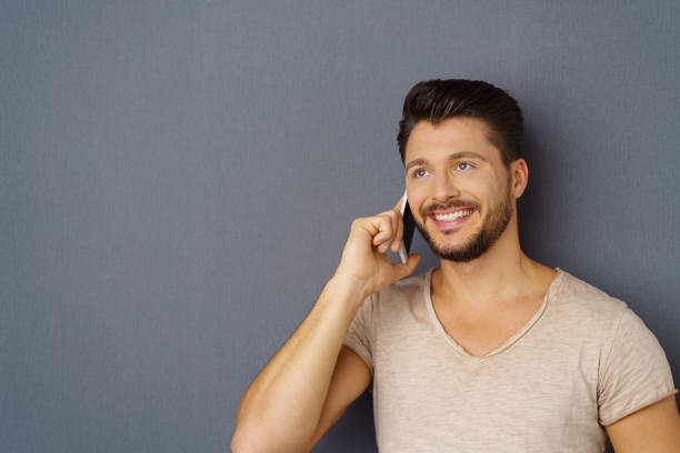 istock Smiling man listening to a mobile phone call 1146433781
