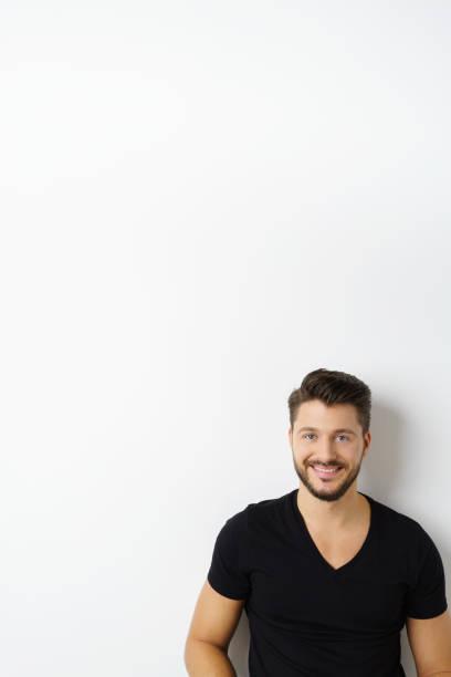 istock Young cheerful man against white wall 1146435093