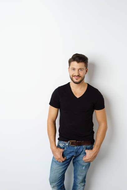 Smiling man standing against white background