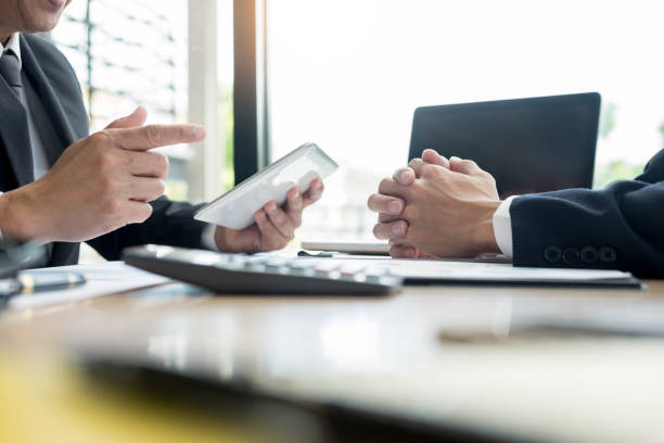 istock High Angle View Of Business People Discussing On Table 1146437794